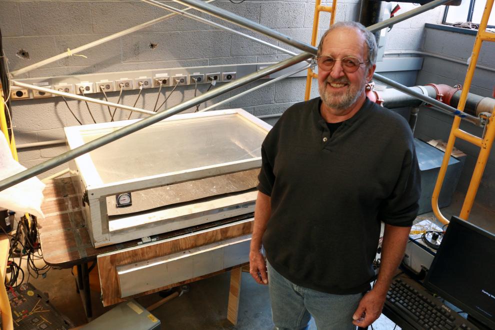 Tim Bond in front of solar oven